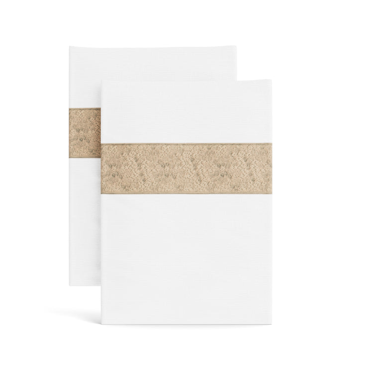 Stacked white Minaudiere pillowcases from the Judith Leiber Couture x Ann Gish collection, detailed with a sand-colored sequined border band that echoes the jeweled Minaudiere motif. - PCMIK‑WHI‑SAN PCMIS‑WHI‑SAN