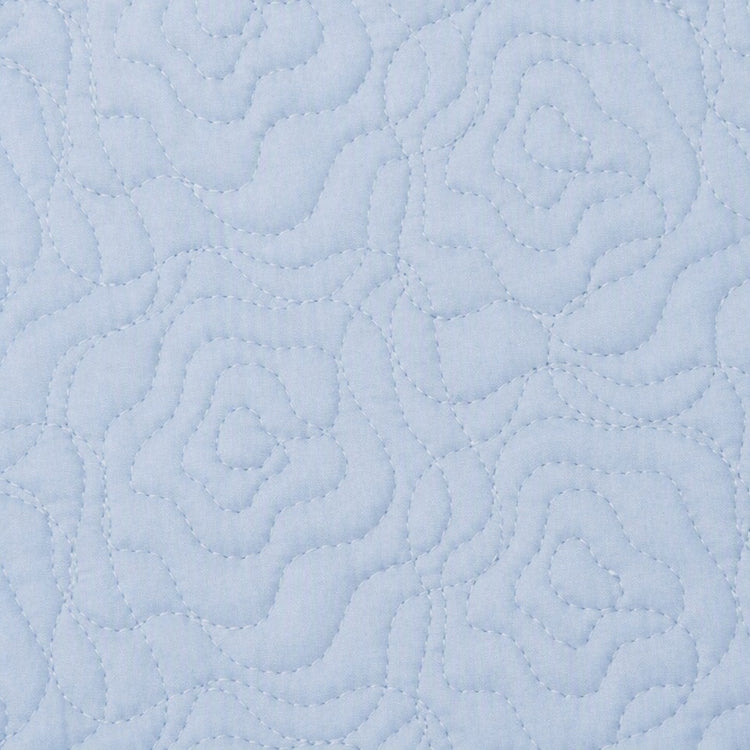 Swatch of the Roses Coverlet Set in Blue from the Judith Leiber Couture by Ann Gish collection, showing the rose quilted pattern and texture. - YSETCORQK-BLE YSETCORQQ-BLE